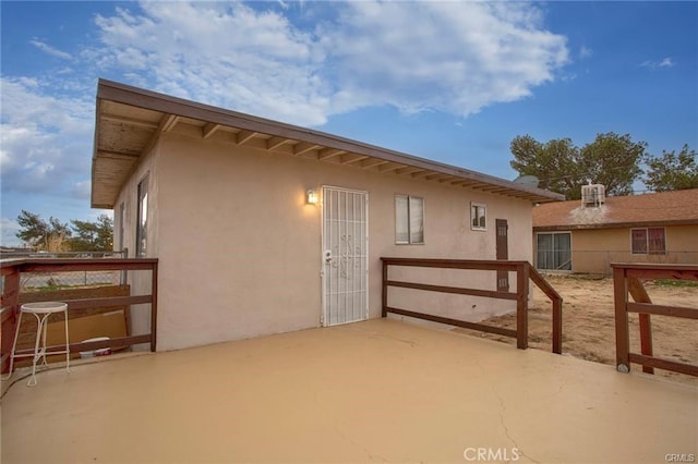 6454 Goleta Ave, Yucca Valley, CA 92284 - back of house featuring stucco siding and a patio area