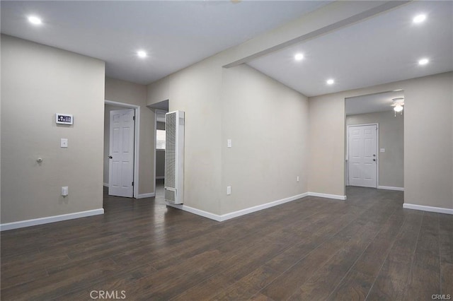 spare room with dark hardwood / wood-style flooring