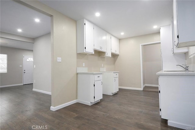 6454 Goleta Ave, Yucca Valley, CA 92284 - kitchen with a sink, baseboards, light countertops, dark wood-type flooring, and recessed lighting