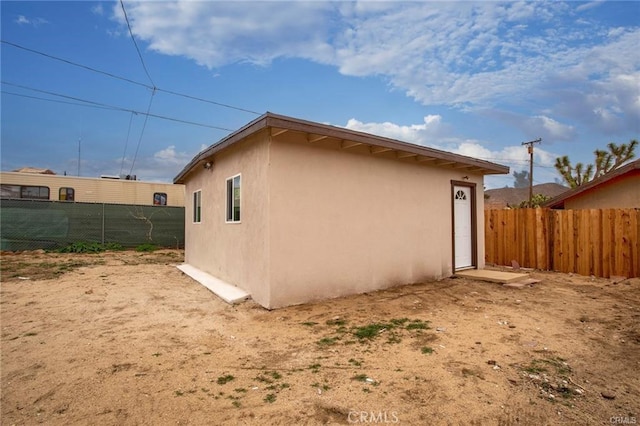 6454 Goleta Ave, Yucca Valley, CA 92284 - view of side of home featuring stucco siding
