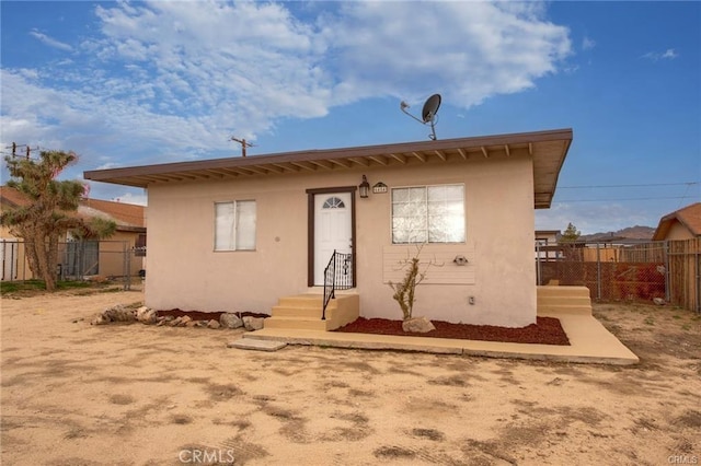6454 Goleta Ave, Yucca Valley, CA 92284 - view of front of home with entry steps and stucco siding