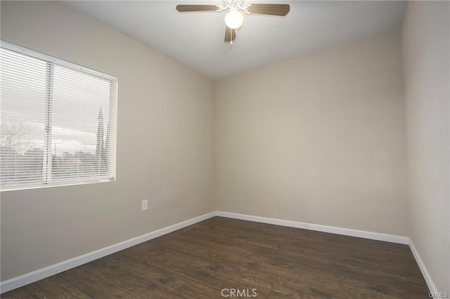 unfurnished room featuring ceiling fan and dark wood-type flooring