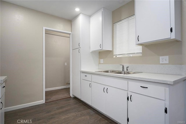 6454 Goleta Ave, Yucca Valley, CA 92284 - kitchen featuring a sink, dark wood-style floors, white cabinetry, light countertops, and recessed lighting