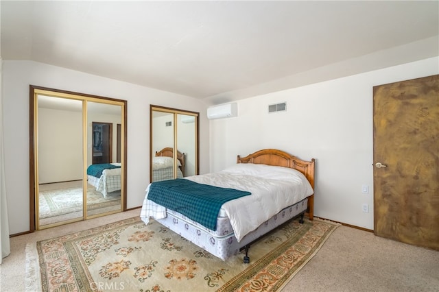 carpeted bedroom featuring multiple closets, a wall mounted AC, and lofted ceiling