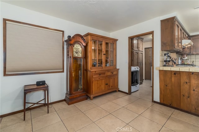 dining room with light tile patterned flooring and washer / clothes dryer