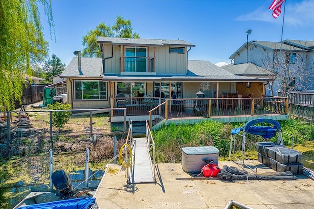 back of property with a patio and a wooden deck