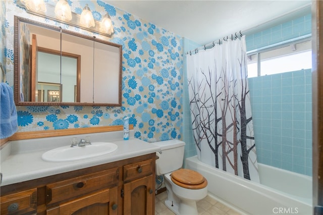 full bathroom featuring shower / tub combo with curtain, vanity, tile patterned floors, and toilet