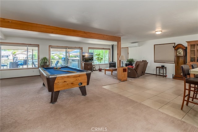 recreation room with pool table, beam ceiling, a wall unit AC, and light colored carpet