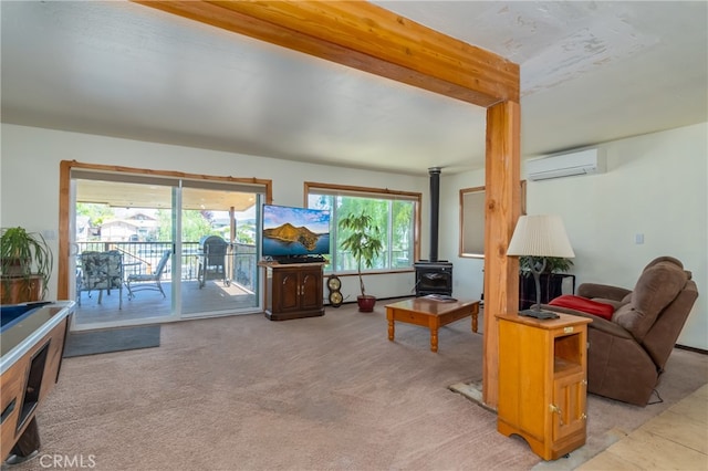 living room featuring an AC wall unit, light colored carpet, a wealth of natural light, and a wood stove