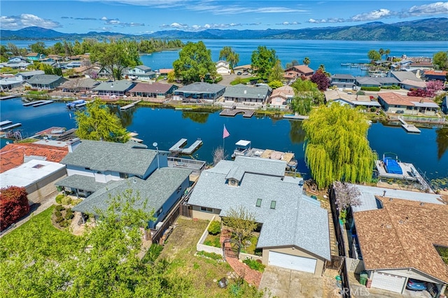 bird's eye view featuring a water and mountain view