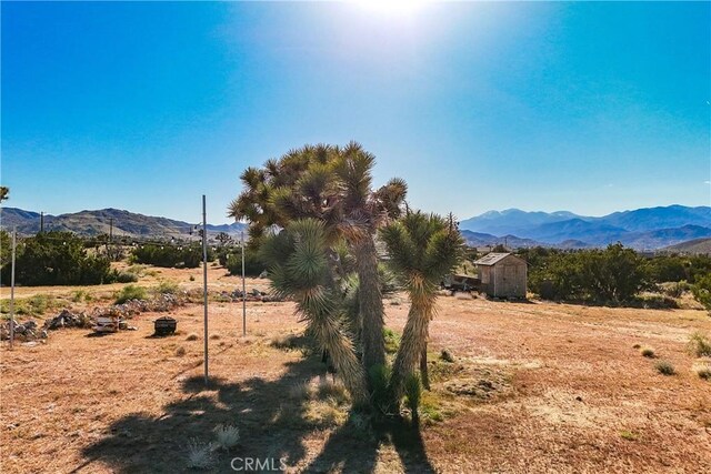 property view of mountains featuring a rural view