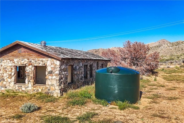 view of side of property with a mountain view