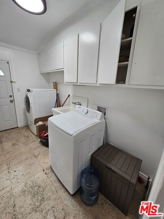 laundry area featuring cabinets, washer hookup, ornamental molding, and sink