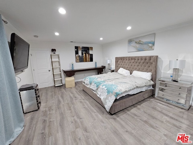 bedroom with light hardwood / wood-style floors