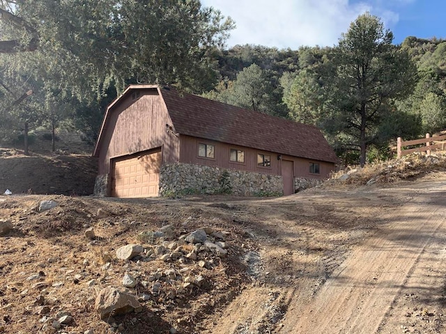 view of side of home with a garage