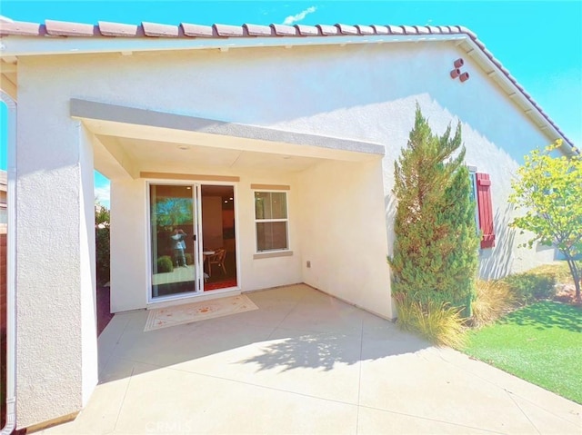 back of property featuring a patio area