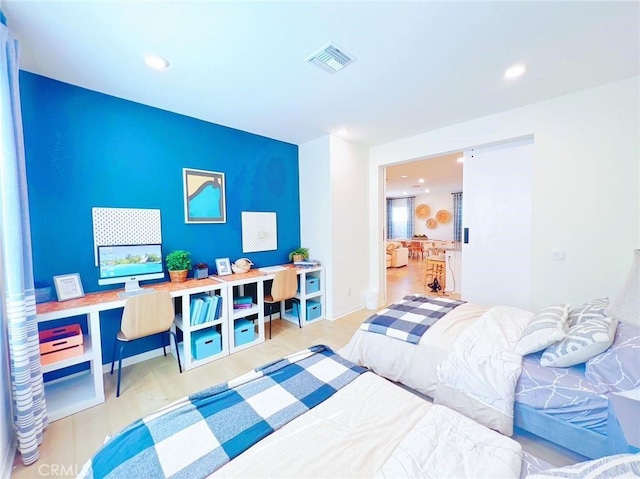 bedroom featuring light wood-type flooring