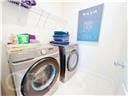 laundry room featuring washing machine and dryer