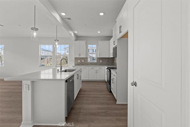 kitchen featuring visible vents, dishwasher, a sink, dark wood finished floors, and black / electric stove