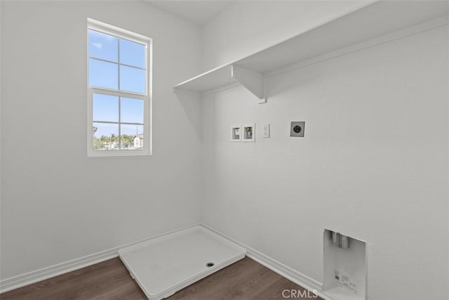 washroom with electric dryer hookup, baseboards, washer hookup, laundry area, and dark wood finished floors