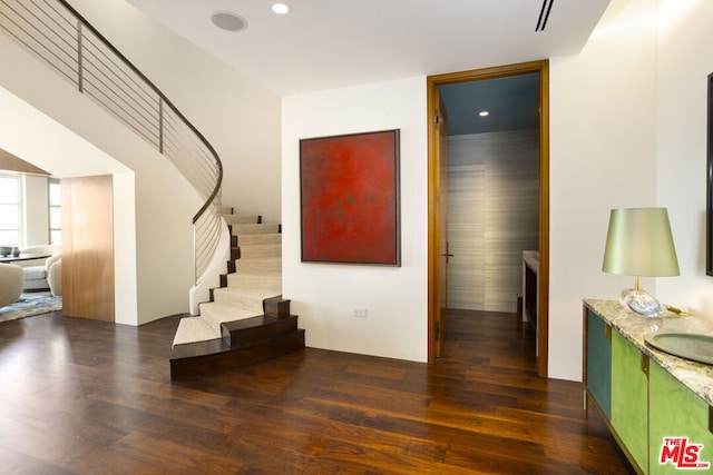 interior space featuring a fireplace and dark hardwood / wood-style floors