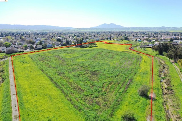 birds eye view of property featuring a mountain view