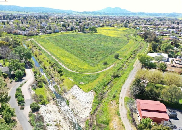 birds eye view of property featuring a mountain view