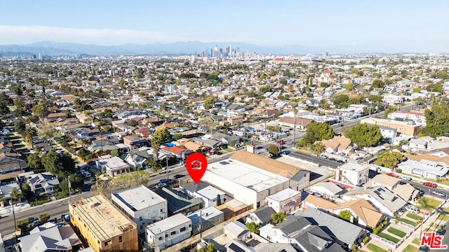 birds eye view of property with a mountain view