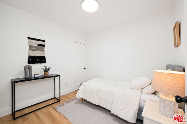 bedroom with light hardwood / wood-style floors