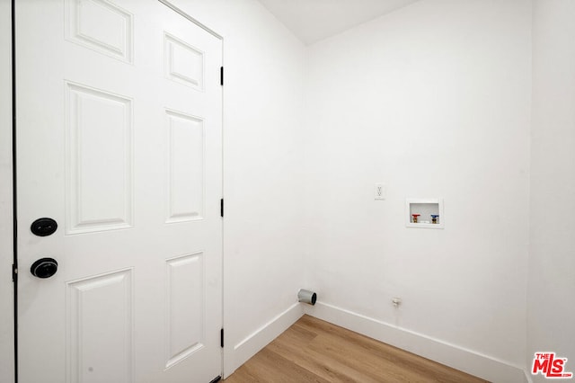 laundry area featuring hookup for a washing machine and light wood-type flooring