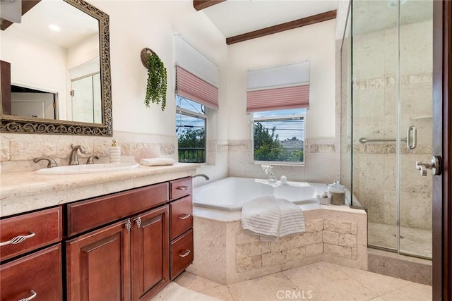 bathroom with independent shower and bath, tile patterned floors, and vanity