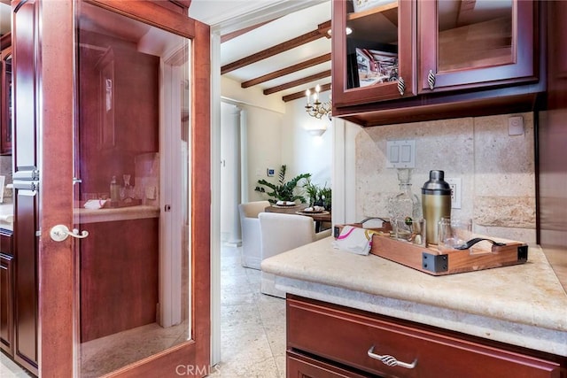 interior space with decorative backsplash, vaulted ceiling with beams, and an inviting chandelier