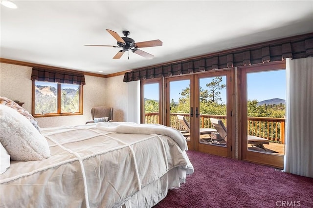 bedroom with access to exterior, multiple windows, carpet floors, and ceiling fan