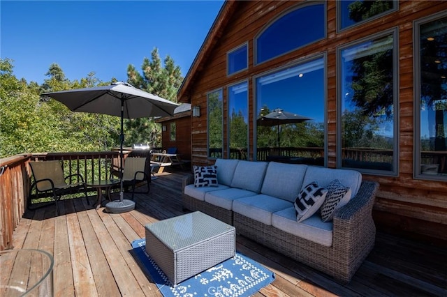 wooden deck with an outdoor living space