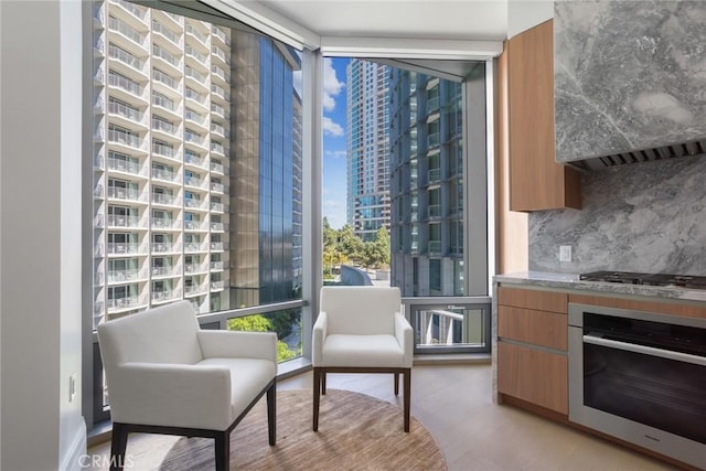 living area featuring plenty of natural light and expansive windows