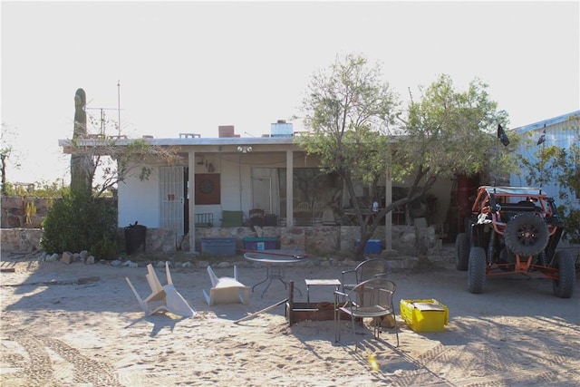 rear view of house featuring a patio