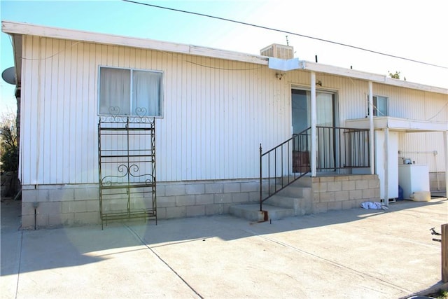 exterior space with a patio area and washer / clothes dryer