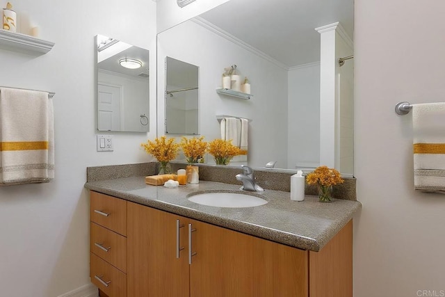 bathroom with vanity and crown molding