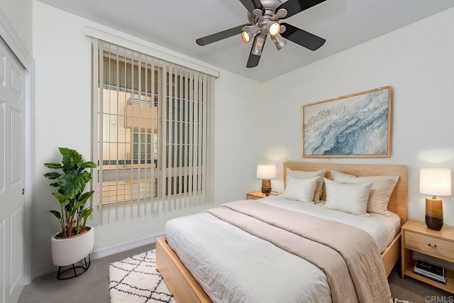 bedroom featuring multiple windows, carpet floors, a closet, and ceiling fan