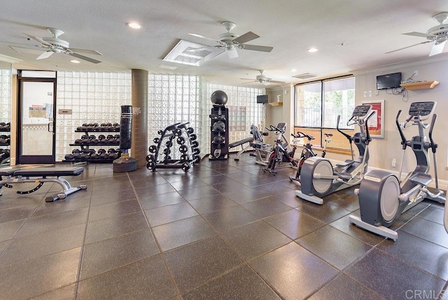 gym featuring ceiling fan and floor to ceiling windows