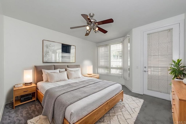 bedroom with ceiling fan and dark carpet