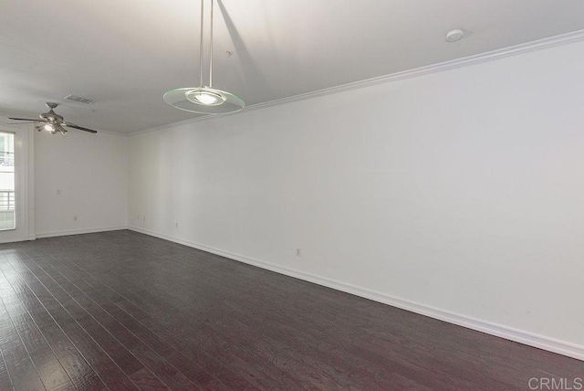 unfurnished room featuring crown molding, dark hardwood / wood-style flooring, and ceiling fan