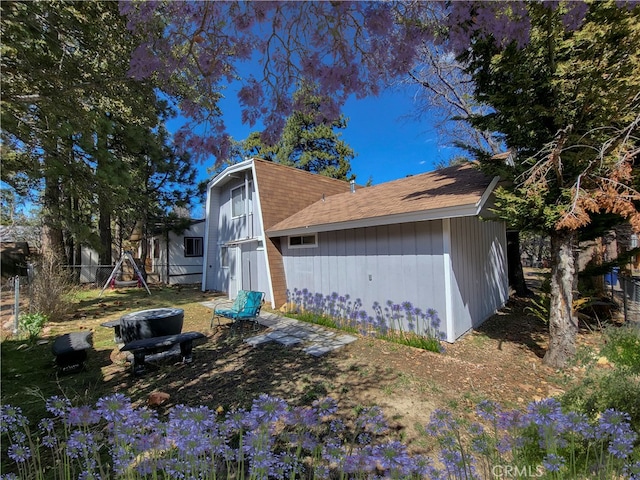 view of property exterior featuring a playground