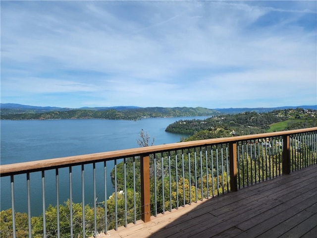 deck featuring a water and mountain view