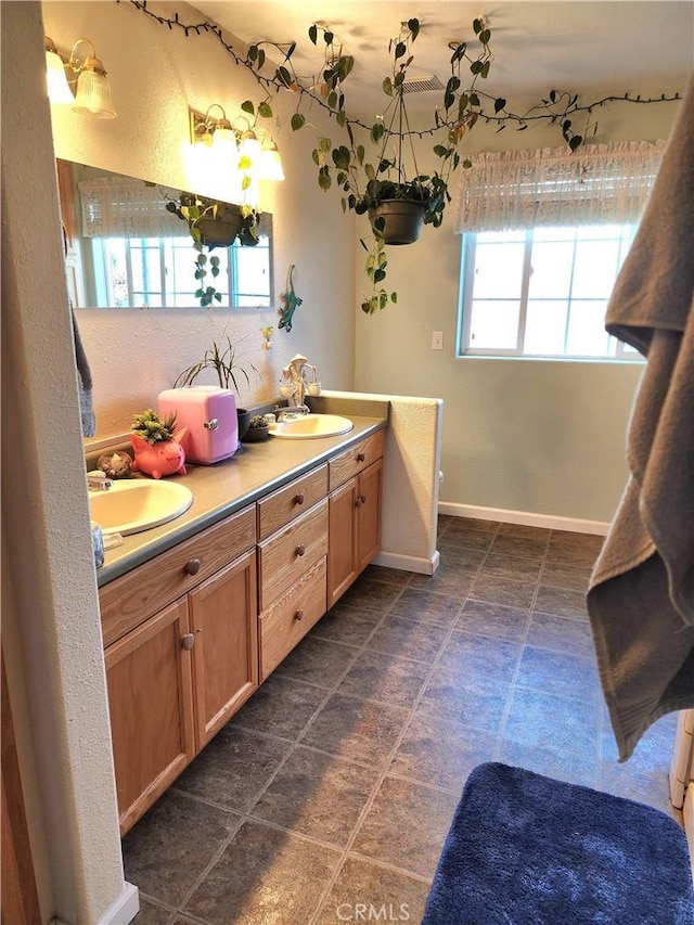 bathroom featuring tile patterned floors and vanity