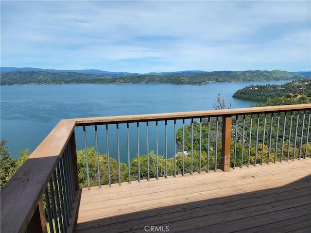 deck featuring a water and mountain view