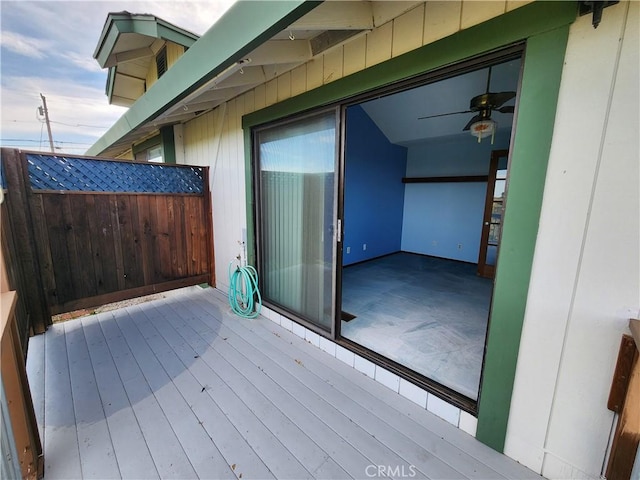 wooden deck featuring ceiling fan