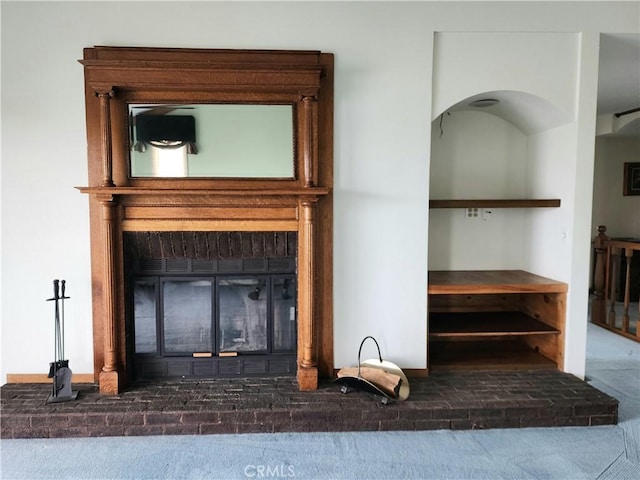 details featuring carpet and a fireplace