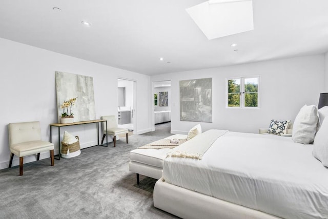 carpeted bedroom featuring a skylight