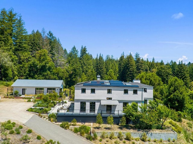 view of front of house with solar panels